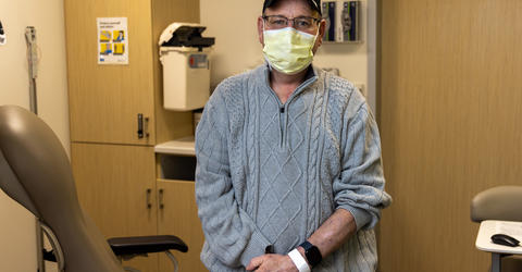 a man standing in a medical exam room