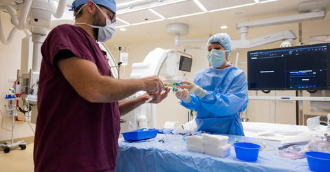 two health care professionals in a cardiac cath lab at University of Iowa Heart and Vascular Center