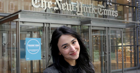University of Iowa alumna Asmaa Elkeurti stands in front of the New York Times building, where she works as a software engineer