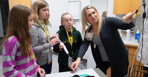 Girls Go STEM participants work with Jacque Kelchen, a respiratory care supervisor at University of Iowa Hospitals and Clinics