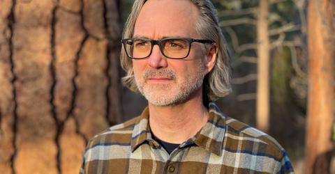 University of Iowa alumnus and film producer Michael Scheuerman outdoors in Oregon