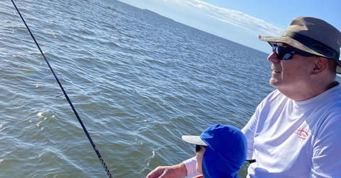 Owen Shunkwiler fishing with his grandchild