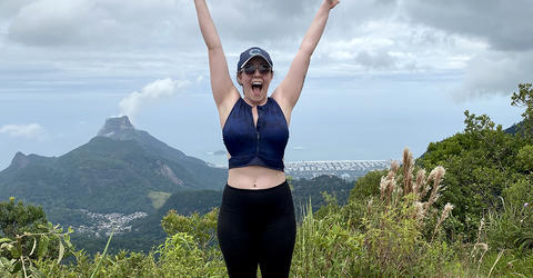 Rebekah Hall raising her arms in Brazil