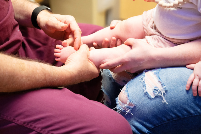 a doctor examines the McDaniel girls during an appointment