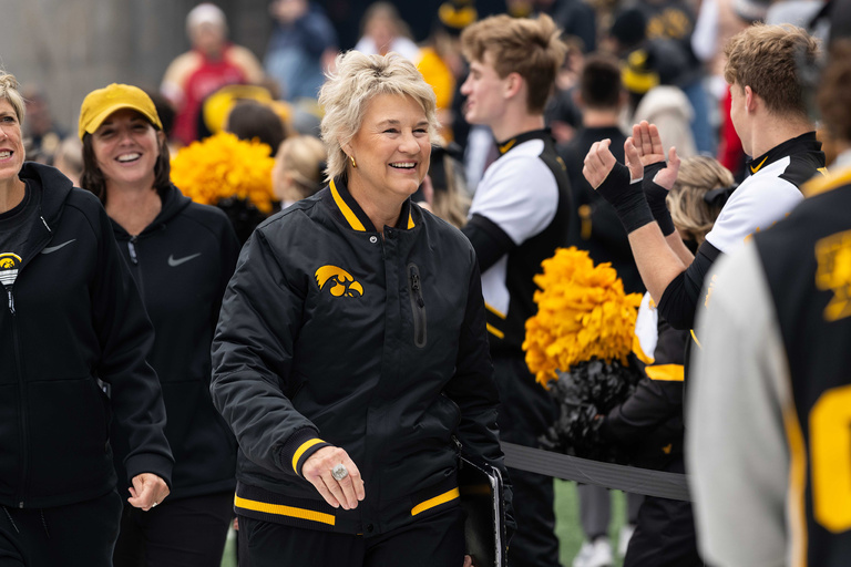 Lisa Bluder greeting the fans at Crossover at Kinnick