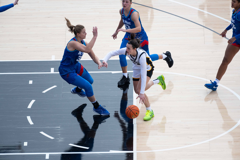 Caitlin Clark drives toward the basket