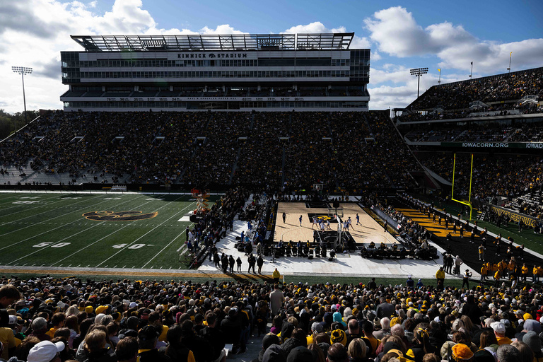 shadows cover part of the court during Crossover at Kinnick