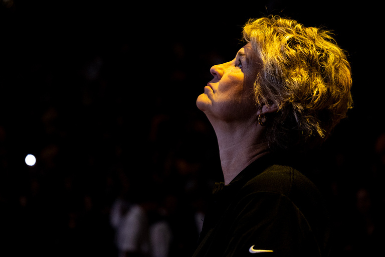a basketball coach looking upward during pregame intros