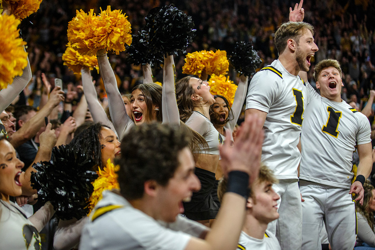 Iowa’s cheerleaders celebrate a Hawkeye victory