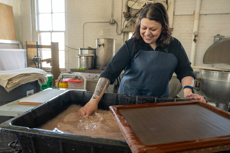 A woman working on a new piece