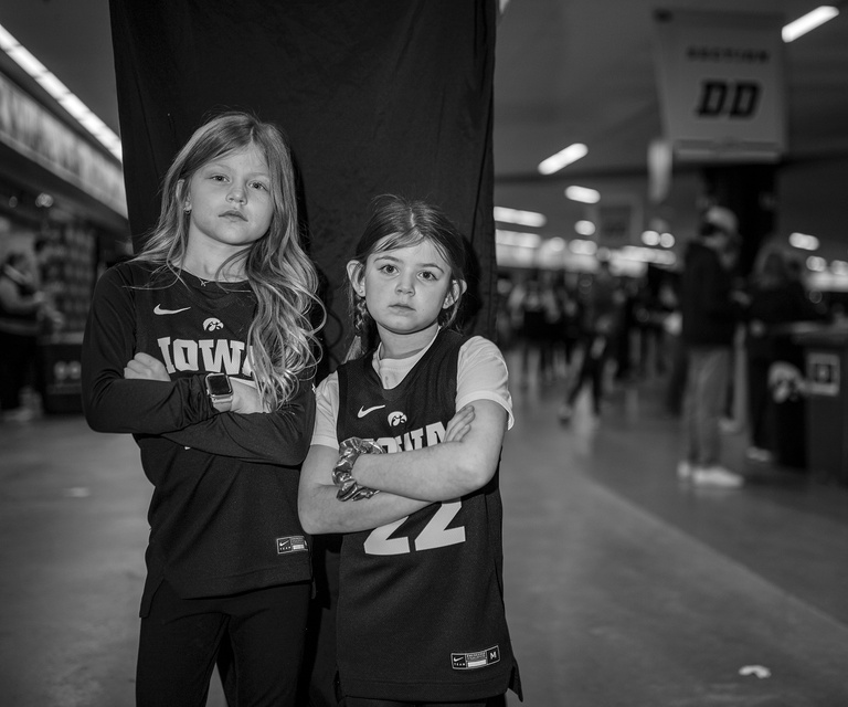 two young girls in iowa jerseys