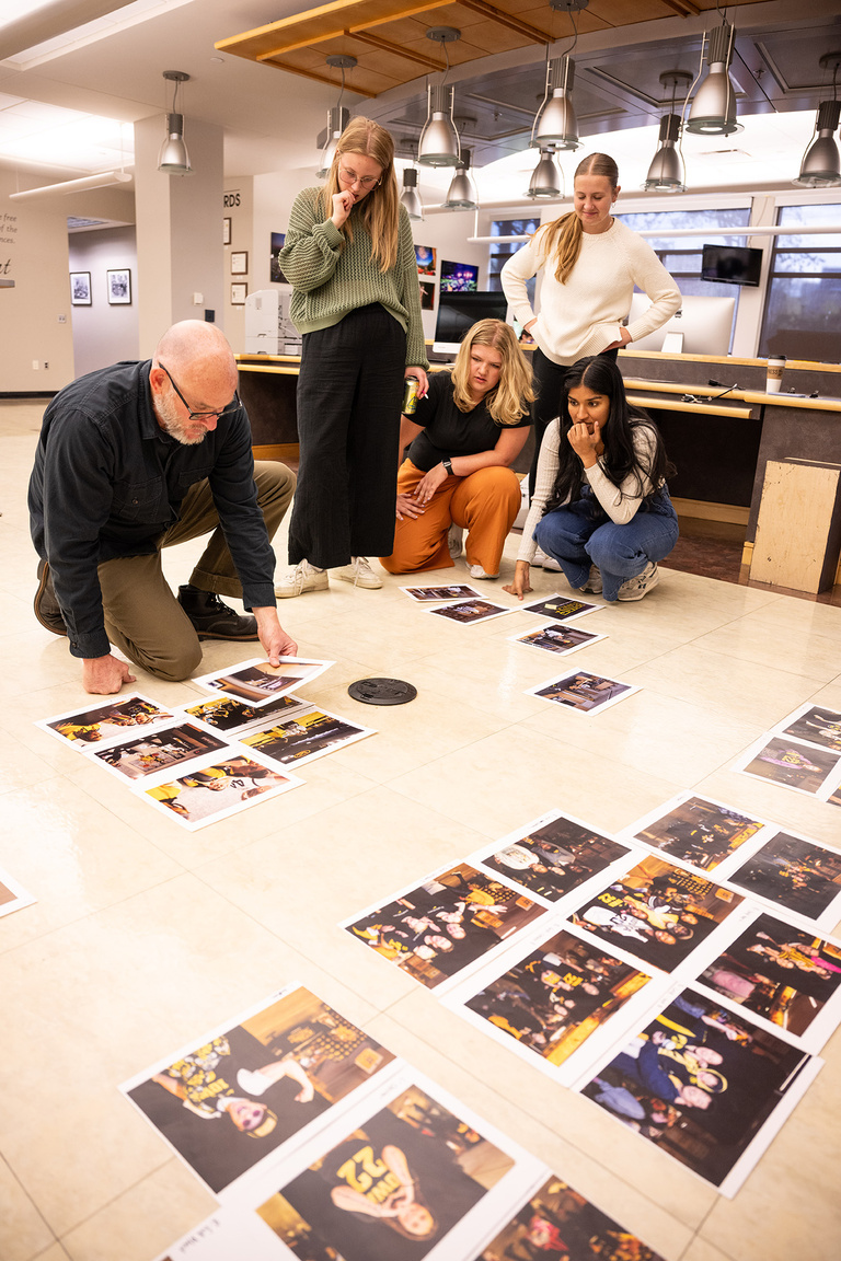 Daily Iowan photojournalists work with professional photographer Danny Wilcox Frazier to select images for the book