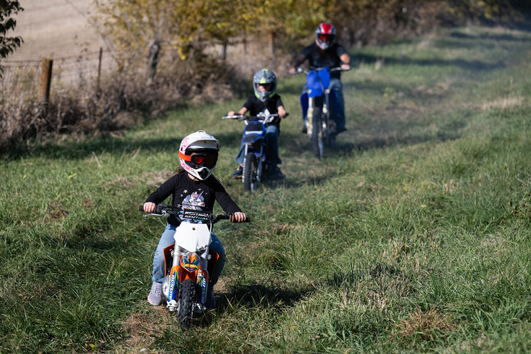 three people riding motorcycles