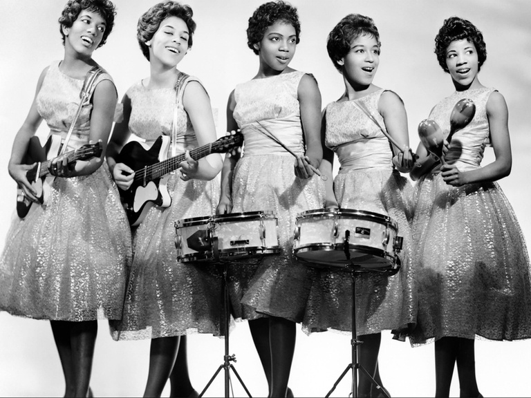 the five members of the Chantels holding their instruments