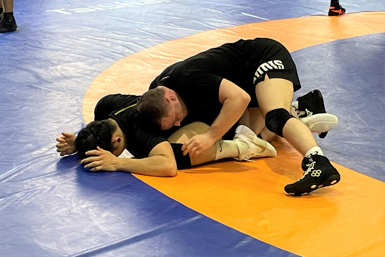 Two guys wrestling eachother