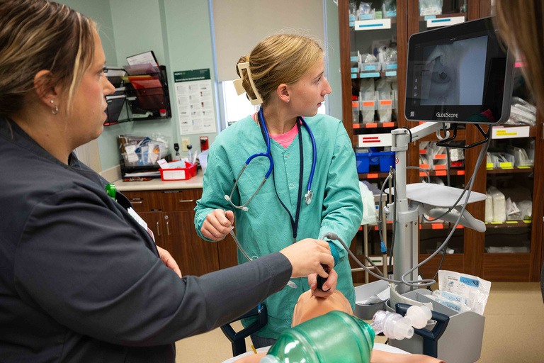A student practicing life saving techniques