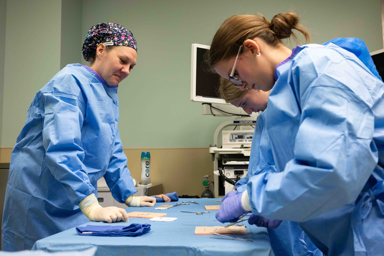 Students practicing stitching techniques