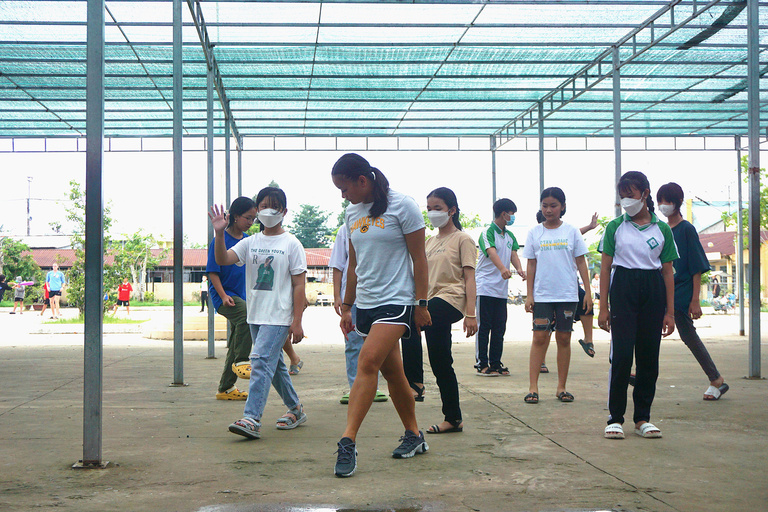 A teacher demonstrating a dance move