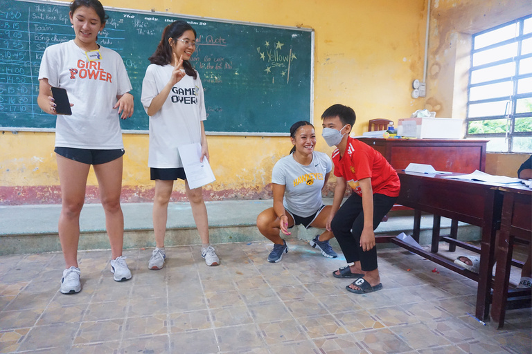 A group of people training a young boy