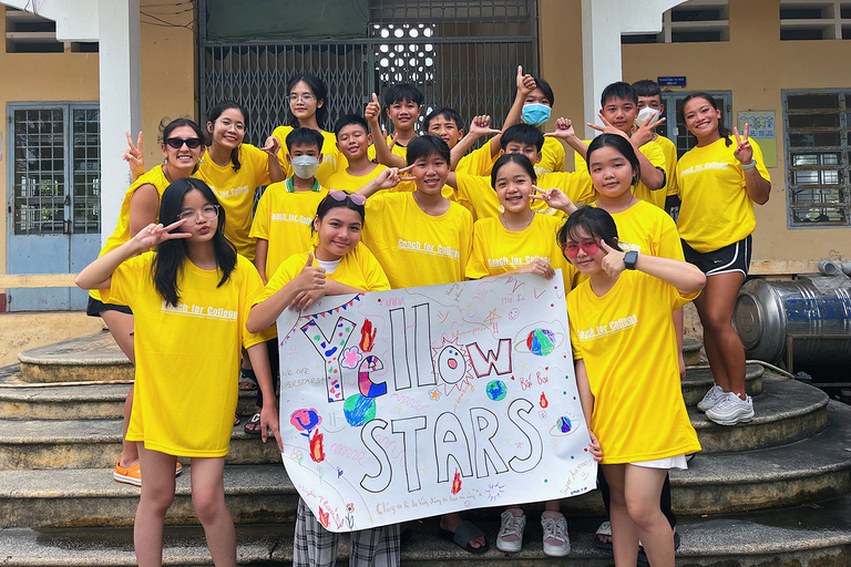 A group of students holding up a poster