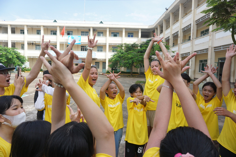A group of kids with their arms in the air