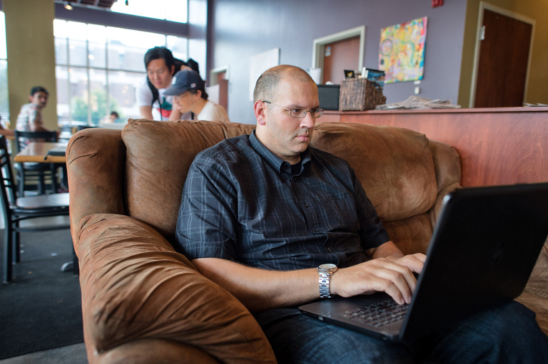 A man studying in a chair