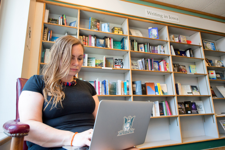 a woman writing in a store