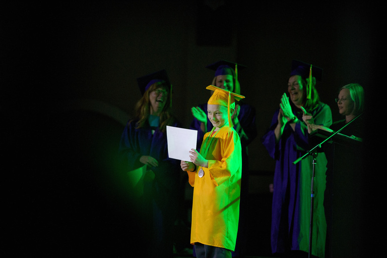 a patient wearing a cap and gown