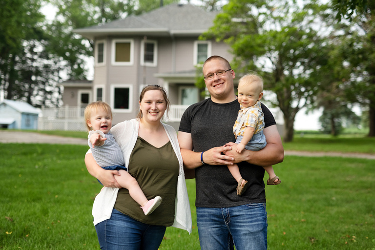 parents holding their toddler-aged twins