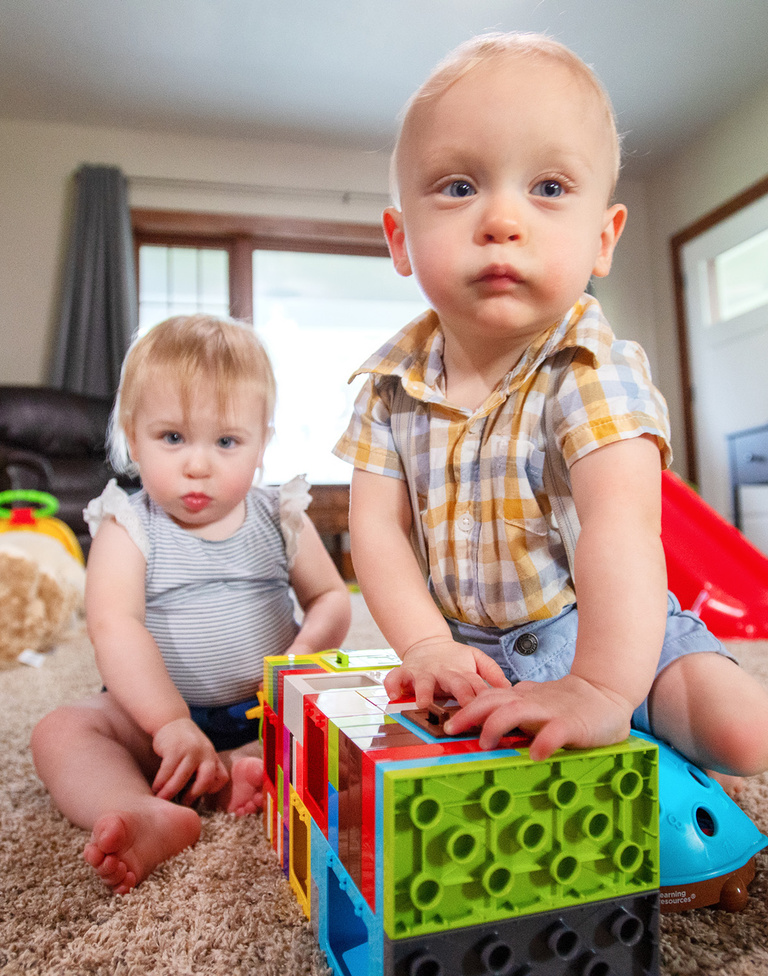 toddlers playing in a living room