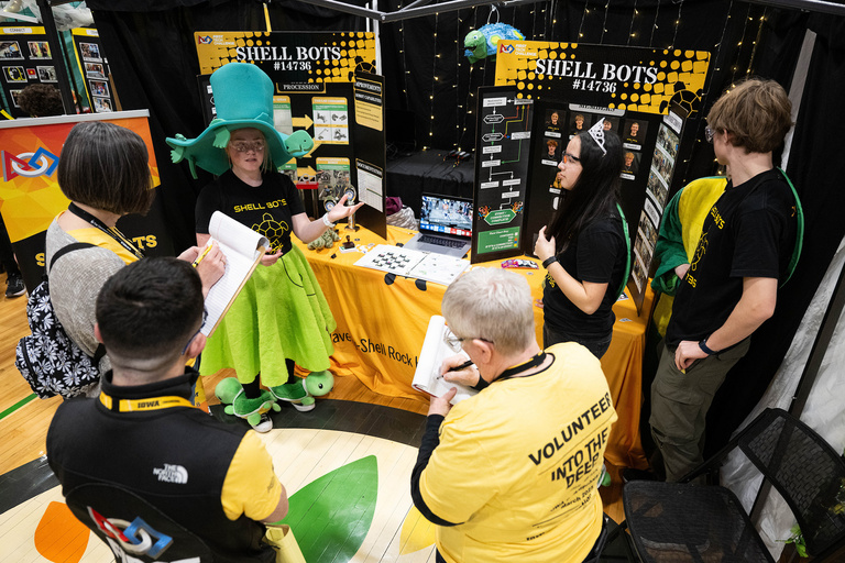A group of people at an informational table