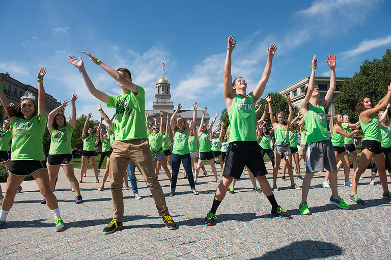 A group of people dancing outside