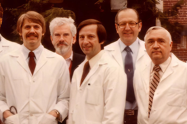 researchers in white coats