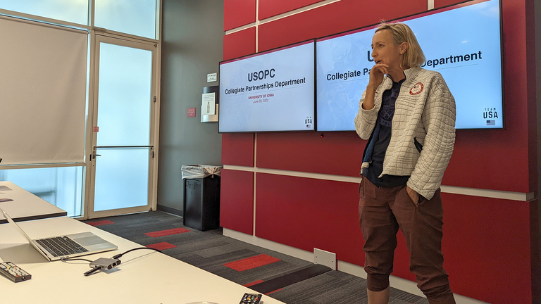 a woman listening to questions during a presentation