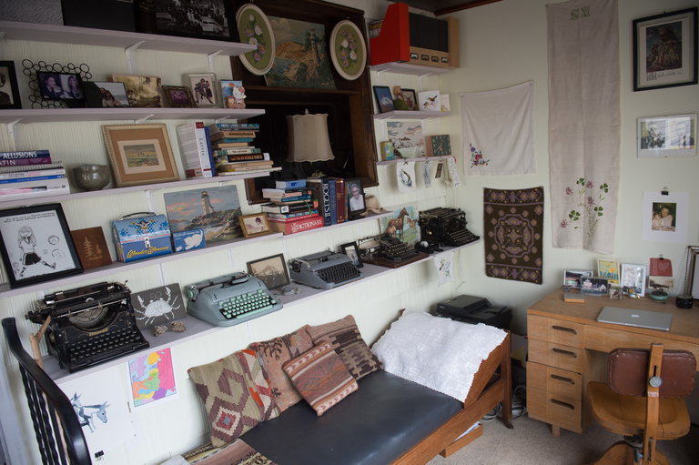 a wall with multiple typewriters on it