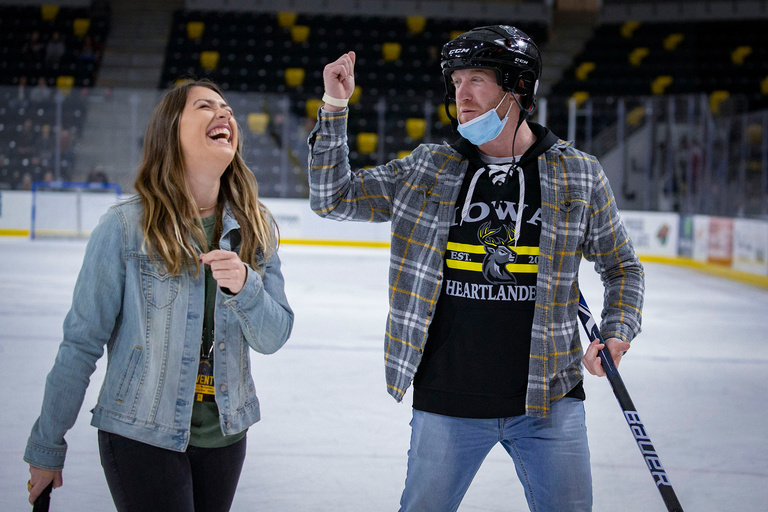 two people lauging together on ice
