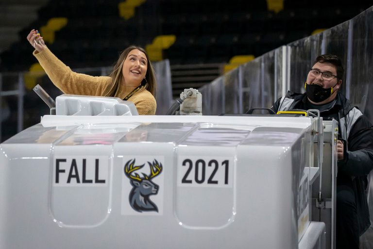 Two people on a Zamboni