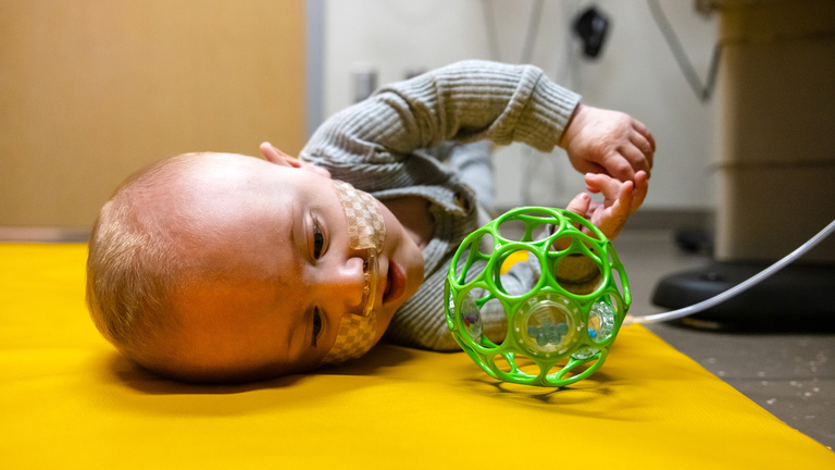 Nash Keen playing with a toy during a clinic visit