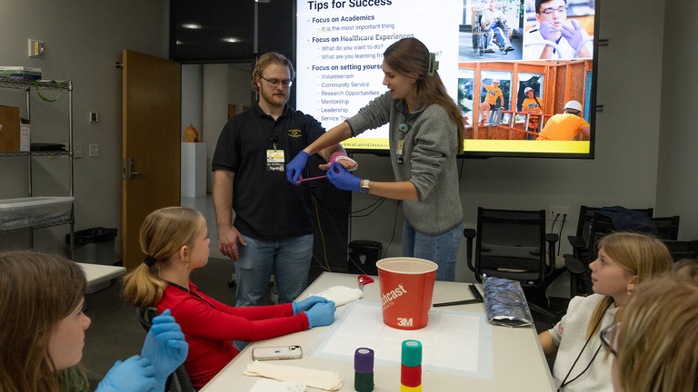 students watch an demonstration at a Kids Go STEM event