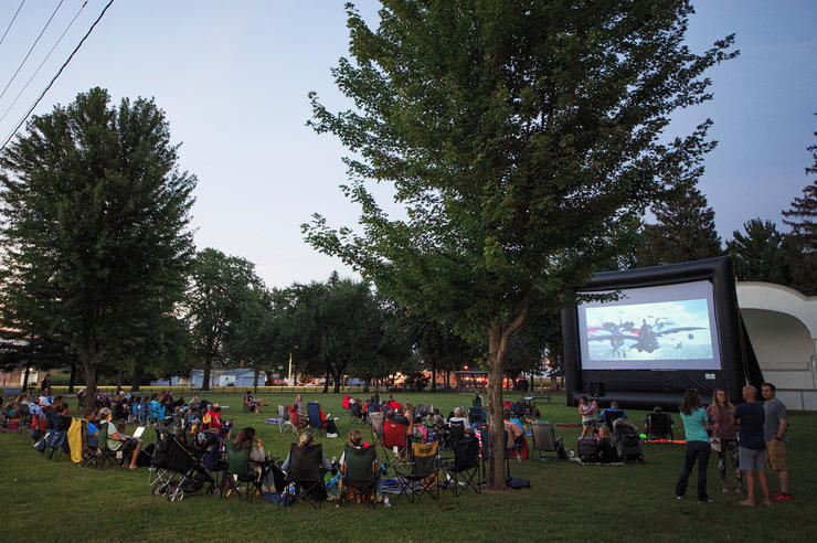a portable movie theater shows a film in a park in new hampton; the business has its roots in a university of iowa innovation program
