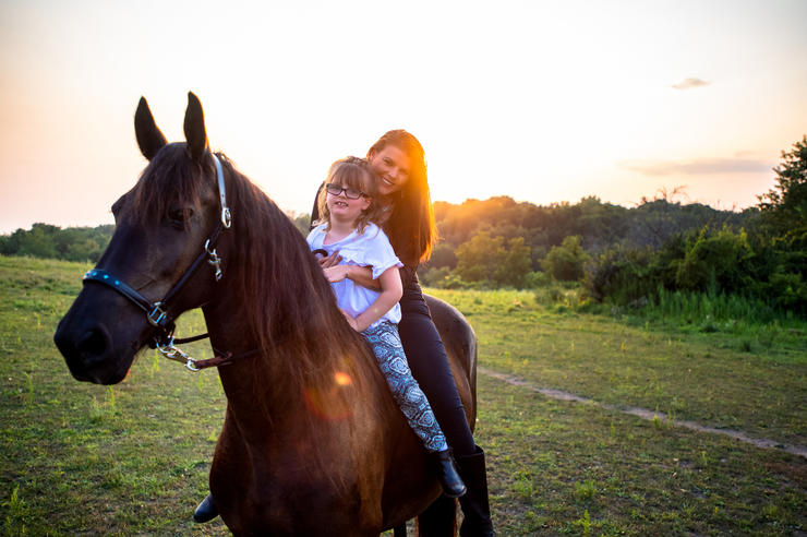 Nevaeh and Kari Brock on one of their horses