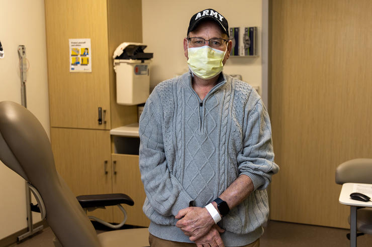a man standing in a medical exam room