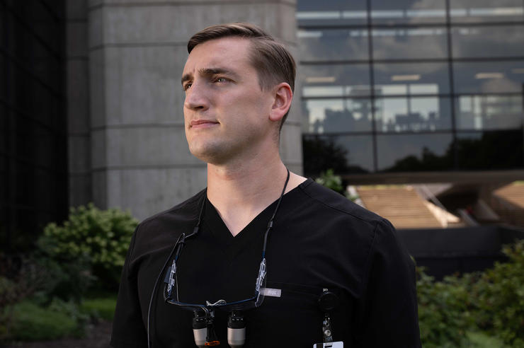 University of Iowa dental student and Army Veteran Zach Graham standing outside the College of Dentistry