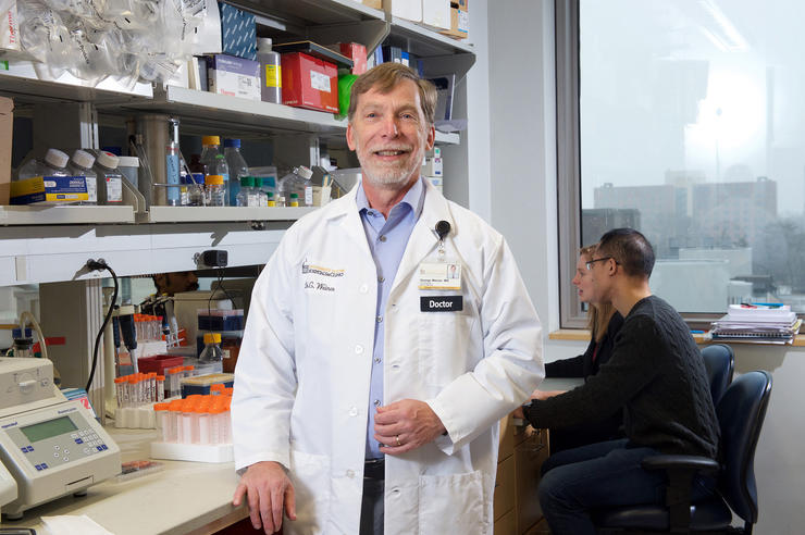 University of Iowa cancer researcher George Weiner standing in his lab