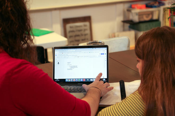 Mindy VanZuiden helps her daughter, Bristol, 10, with homework in Williamsburg on Tuesday, May 18, 2021. Bristol, who struggles with dysgraphia, uses Google’s speech-to-text feature to strengthen her handwriting skills