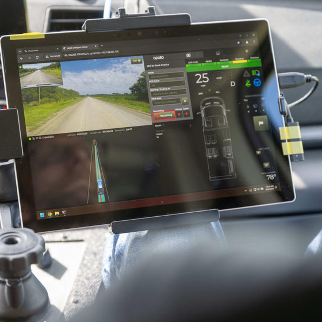 A screen in a car that shows the road it is mapping