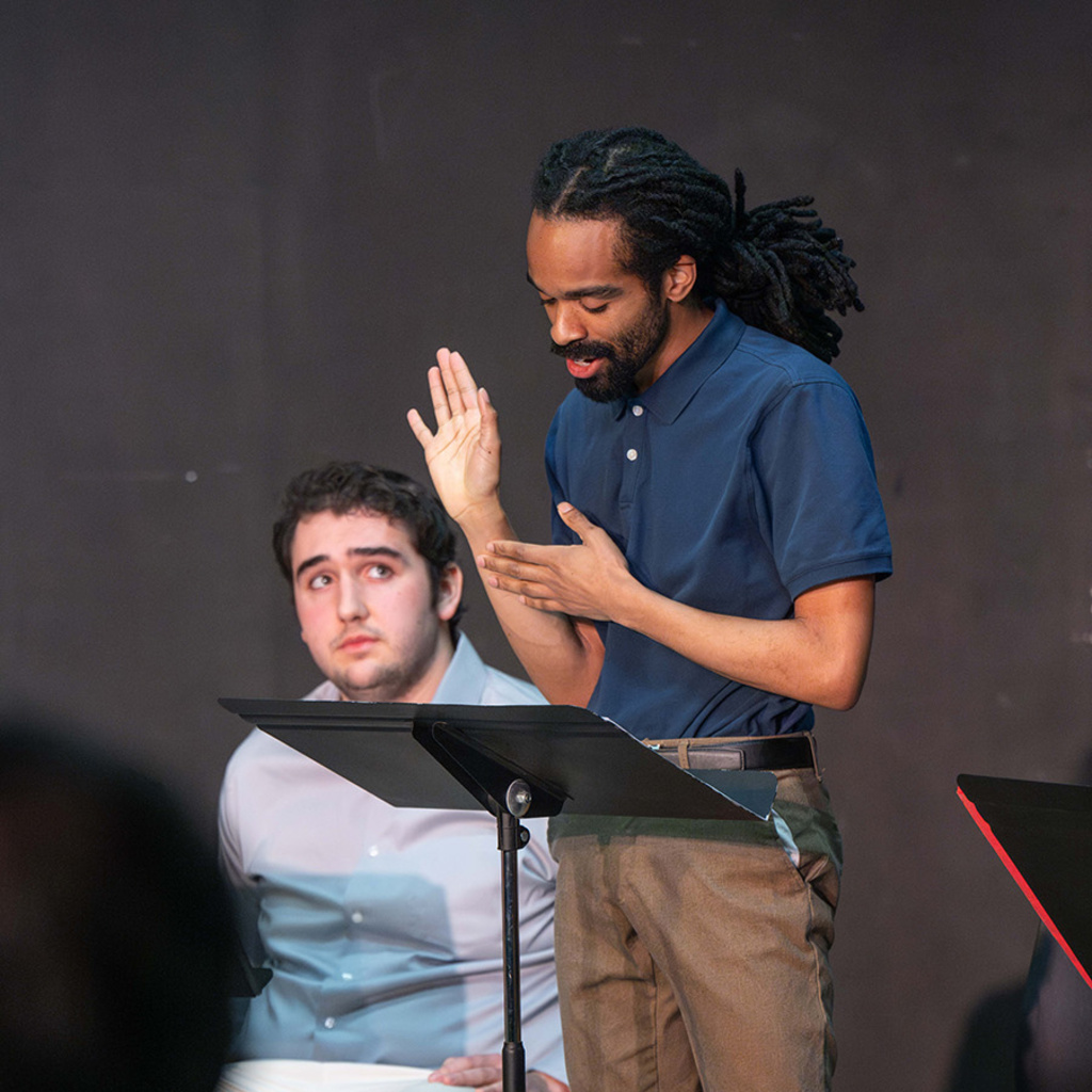 Preston Coleman, a University of Iowa student in acting, performs at a staged reading of a play