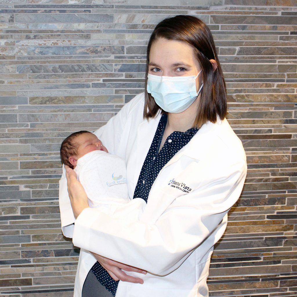 Liz Dupic holding a baby