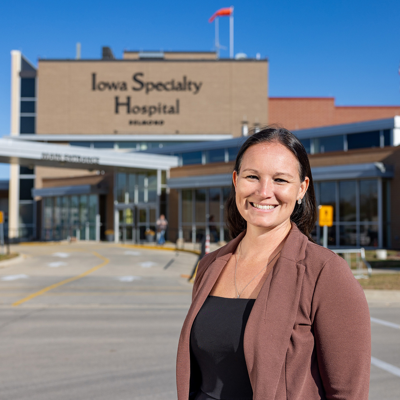 a woman standing outside a hospital