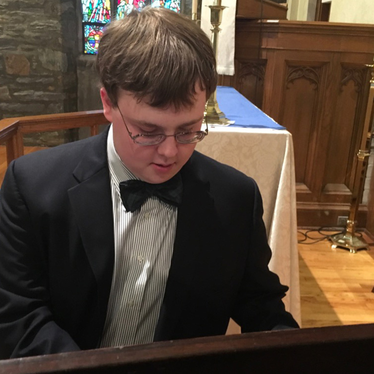 a boy playing piano